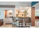 Kitchen bar featuring a granite countertop, stylish seating, and seamless access to the well-equipped kitchen at 399 150Th Ave # 315, Madeira Beach, FL 33708