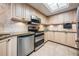 Bright kitchen featuring stainless steel appliances, ample counter space, and stylish tile backsplash at 399 150Th Ave # 315, Madeira Beach, FL 33708