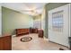 A spacious room with tile flooring, a ceiling fan, and a large window for ample natural light at 399 150Th Ave # 315, Madeira Beach, FL 33708