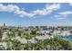 Neighborhood view overlooking the water and other residential properties on a sunny day at 399 150Th Ave # 315, Madeira Beach, FL 33708