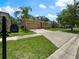 Front exterior of home, featuring an attached garage and a lush front lawn at 4079 Pacente Loop, Wesley Chapel, FL 33543