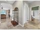 Hallway leading to bathroom and living room featuring an open floor plan at 4079 Pacente Loop, Wesley Chapel, FL 33543