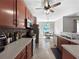 Well lit kitchen with stainless appliances, granite countertops and attached dining area at 4079 Pacente Loop, Wesley Chapel, FL 33543