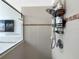 Shower featuring a newer shower head, tiled surround and glass shower door at 4079 Pacente Loop, Wesley Chapel, FL 33543