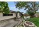 Backyard featuring a fire pit, chairs, brick pavers, and mature tree at 4143 Gray Squirrel Ln, New Port Richey, FL 34653