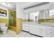 Bright bathroom featuring yellow tiling and updated vanity at 4143 Gray Squirrel Ln, New Port Richey, FL 34653