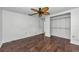 Hardwood floors, ceiling fan, and access to closet at 4143 Gray Squirrel Ln, New Port Richey, FL 34653