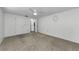 Spacious bedroom with neutral carpet and walk-in closet at 4143 Gray Squirrel Ln, New Port Richey, FL 34653