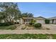 Charming single-story home featuring mature trees and well-maintained landscaping at 4143 Gray Squirrel Ln, New Port Richey, FL 34653