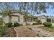Charming single-story house with landscaped front yard and brick pathway at 4143 Gray Squirrel Ln, New Port Richey, FL 34653