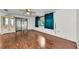 Open living room features hardwood flooring and natural light at 4143 Gray Squirrel Ln, New Port Richey, FL 34653
