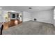 Spacious living room with plush carpet and ample natural light at 4143 Gray Squirrel Ln, New Port Richey, FL 34653