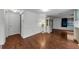 Inviting living room area with laminate flooring, a decorative lamp, and neutral paint at 4143 Gray Squirrel Ln, New Port Richey, FL 34653