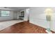 Open living space featuring mixed flooring types, natural light, and neutral colors at 4143 Gray Squirrel Ln, New Port Richey, FL 34653