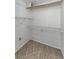 Walk-in closet with neutral carpet and wire shelving at 4143 Gray Squirrel Ln, New Port Richey, FL 34653
