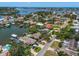 Stunning aerial view of waterfront homes with lush landscaping, canals and easy access to the open bay at 4146 Harbor Hills Dr, Largo, FL 33770