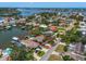 Waterfront home with pool and dock on a canal, offering a prime location for boating and water activities at 4146 Harbor Hills Dr, Largo, FL 33770