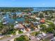 Aerial view of waterfront property showcasing the home's location and expansive water access in a vibrant community at 4146 Harbor Hills Dr, Largo, FL 33770