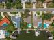 An aerial view showcases a neighborhood with private pools, boat docks, and waterfront access at 4146 Harbor Hills Dr, Largo, FL 33770