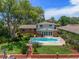 Private backyard featuring a sparkling pool, lush landscaping, and an inviting patio area for outdoor living at 4146 Harbor Hills Dr, Largo, FL 33770