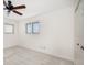 This is a bright, airy bedroom with plush carpeting, white walls, and a ceiling fan to maximize comfort at 4146 Harbor Hills Dr, Largo, FL 33770