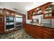 This gourmet kitchen features custom wood cabinetry, granite countertops, and stainless steel appliances at 4146 Harbor Hills Dr, Largo, FL 33770