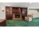 Warm and inviting living room with a brick fireplace, custom built-ins, and cozy seating area at 4146 Harbor Hills Dr, Largo, FL 33770