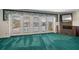 Cozy room with French doors that lead to a screened in lanai and outdoor entertainment space at 4146 Harbor Hills Dr, Largo, FL 33770