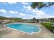 Backyard with a sparkling blue pool overlooking a tranquil waterfront view, perfect for relaxation at 4146 Harbor Hills Dr, Largo, FL 33770