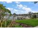 Waterfront home with a dock perfect for boating and enjoying scenic views; the property is beautifully landscaped at 4146 Harbor Hills Dr, Largo, FL 33770