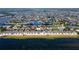 Waterfront community with homes across street from sandy beach with parking, boats and easy ocean access at 4252 Floramar Ter, New Port Richey, FL 34652
