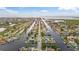 Waterfront aerial view of a coastal community with canals and boat docks at 4252 Floramar Ter, New Port Richey, FL 34652
