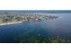 Beautiful waterfront property with many houses, boats, and a sandy beach on the coast of the ocean at 4252 Floramar Ter, New Port Richey, FL 34652