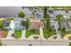 Aerial view of waterfront home with dock, well-manicured lawn and canal access at 4252 Floramar Ter, New Port Richey, FL 34652