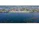 Beautiful waterfront property with many houses, boats, and a sandy beach on the coast of the ocean at 4252 Floramar Ter, New Port Richey, FL 34652