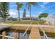Waterfront home with a backyard, canal, and dock, providing a serene outdoor space and access to the water at 4252 Floramar Ter, New Port Richey, FL 34652
