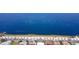 A beautiful ocean with many boats and houses on the coast with a white sandy beach and parking at 4252 Floramar Ter, New Port Richey, FL 34652