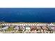 Overhead view of sandy beach with shelters, parking, and homes along the beautiful waterfront property at 4252 Floramar Ter, New Port Richey, FL 34652