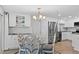Charming dining area with modern lighting and stainless steel appliances at 4252 Floramar Ter, New Port Richey, FL 34652