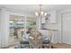 Bright dining area boasts waterfront views and easy access to outdoor spaces at 4252 Floramar Ter, New Port Richey, FL 34652