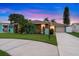 Charming home featuring a well-manicured lawn, a driveway, and a two-car garage, blending comfort and style at 4252 Floramar Ter, New Port Richey, FL 34652