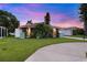 Charming single-story home with well-maintained lawn, long driveway, and lovely landscaping at 4252 Floramar Ter, New Port Richey, FL 34652