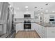 Bright kitchen featuring new stainless appliances, ample counter space and a modern design at 4252 Floramar Ter, New Port Richey, FL 34652
