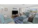 Cozy living room featuring stylish furniture, nautical-themed décor, and a relaxing atmosphere at 4252 Floramar Ter, New Port Richey, FL 34652