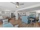 Open-concept living room featuring stylish furnishings, hardwood floors, and abundant natural light at 4252 Floramar Ter, New Port Richey, FL 34652
