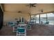 Spacious screened-in patio with ceiling fans and ample seating for outdoor enjoyment at 4252 Floramar Ter, New Port Richey, FL 34652
