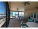 Image showcases the screened-in patio area with plenty of comfortable seating and ceiling fans at 4252 Floramar Ter, New Port Richey, FL 34652