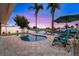 Backyard swimming pool with lounge chairs and a lovely view of the waterfront and gorgeous sunset at 4252 Floramar Ter, New Port Richey, FL 34652