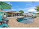 Inviting backyard pool surrounded by a paved deck, perfect for lounging and enjoying the outdoor space. Includes lanai at 4252 Floramar Ter, New Port Richey, FL 34652