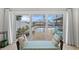 A bench seat looks out over the pool, patio, and boat dock in this tranquil waterfront home at 4252 Floramar Ter, New Port Richey, FL 34652